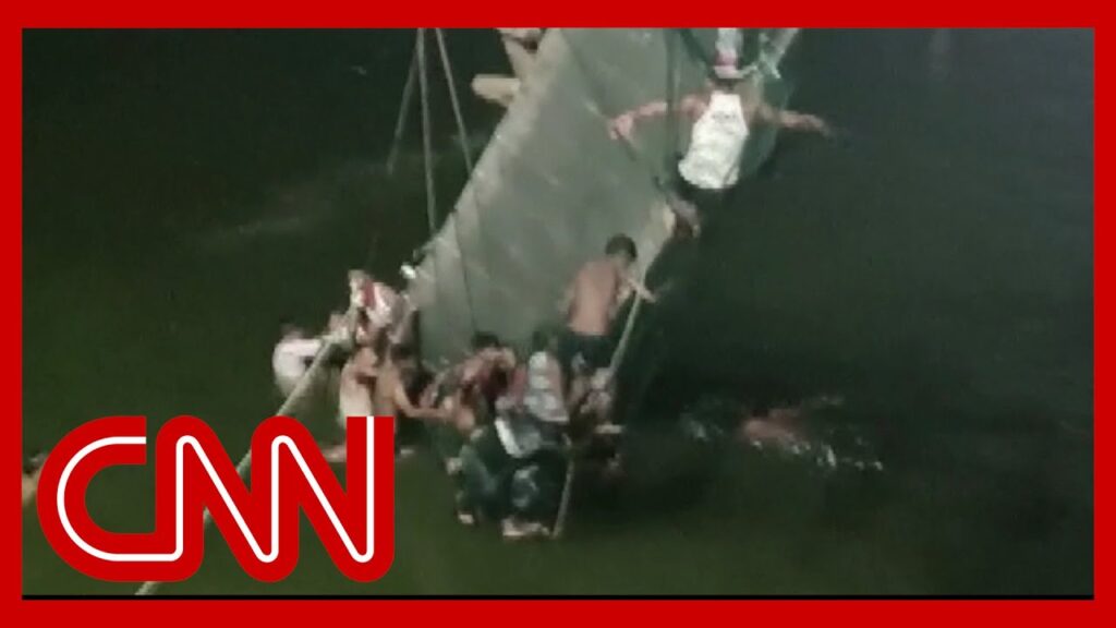 Video shows people clinging to wreckage after bridge crash kills dozens in India