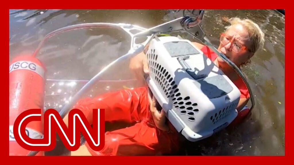 Watch US Coast Guard rescue woman from flooded neighborhood