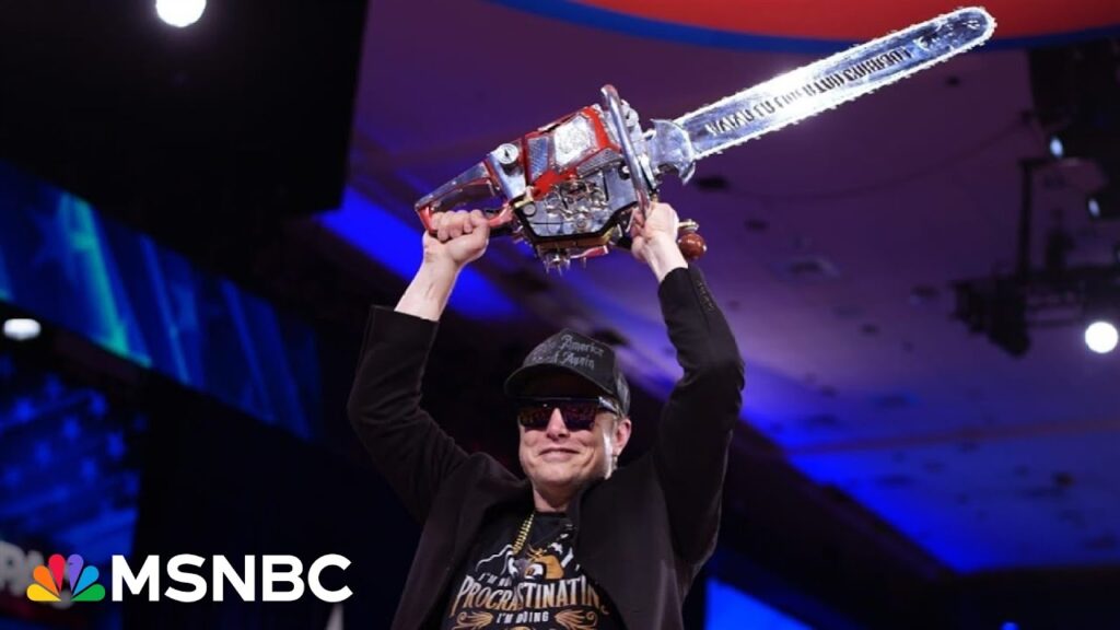 Musk on stage with chainsaw, ‘proud of what he’s doing’ with cuts that impact Americans