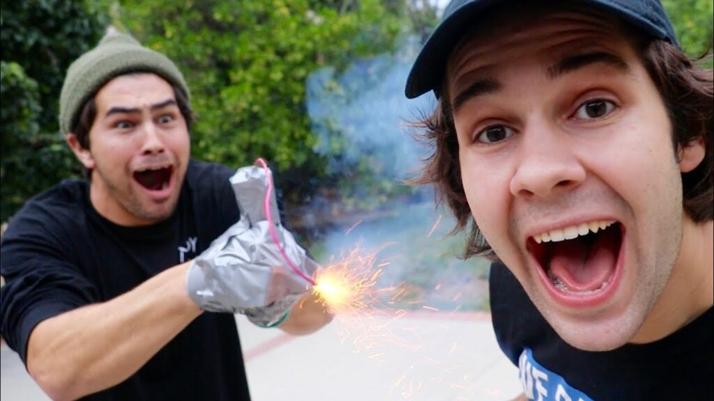 TAPING A FIREWORK TO HIS HAND!! (EXPLOSION)