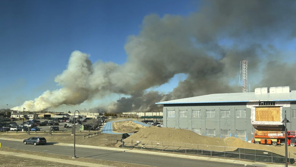 Firefighters knock down wind-driven brush fire on Long Island but risk remains with high winds