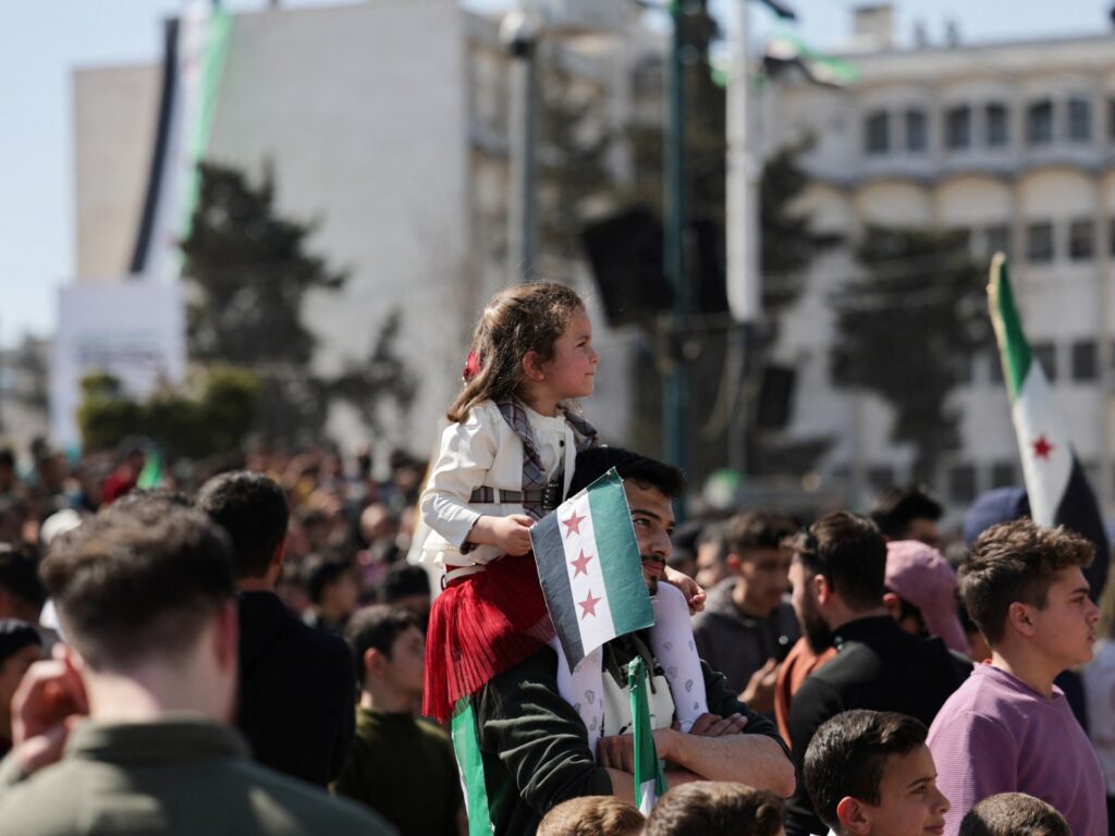 Syrians mark revolution anniversary with roses, songs and tight security | News