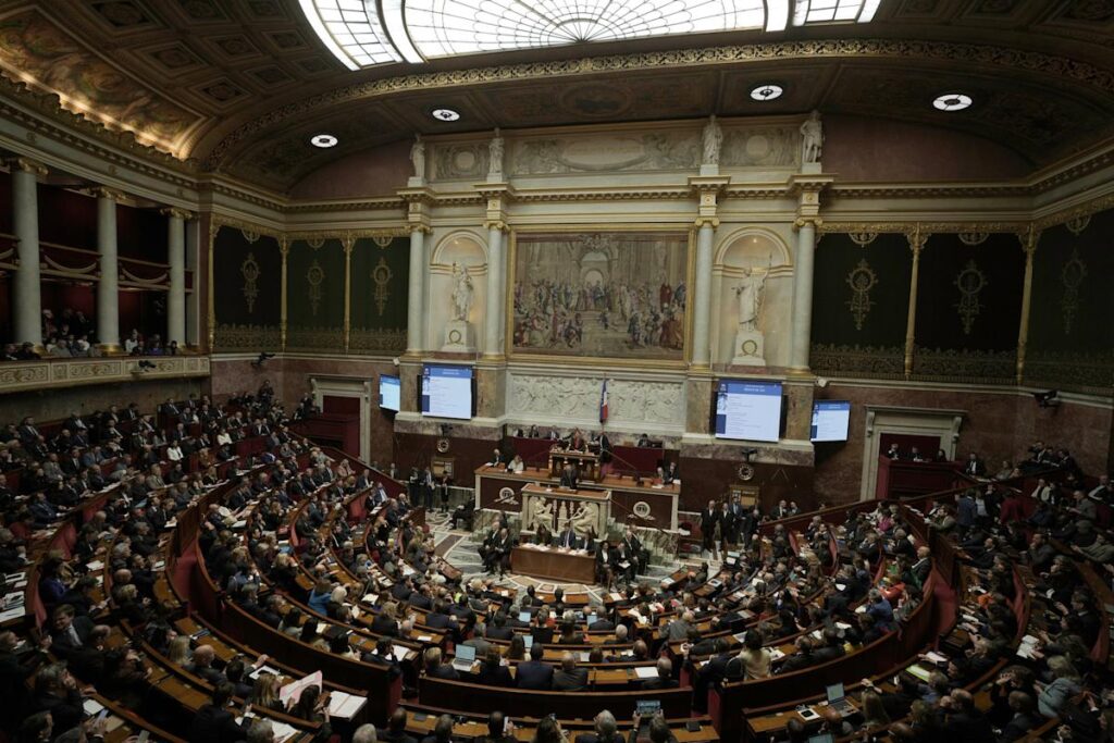 French lawmaker who uses a wheelchair wins a change in voting rules that discriminated against him