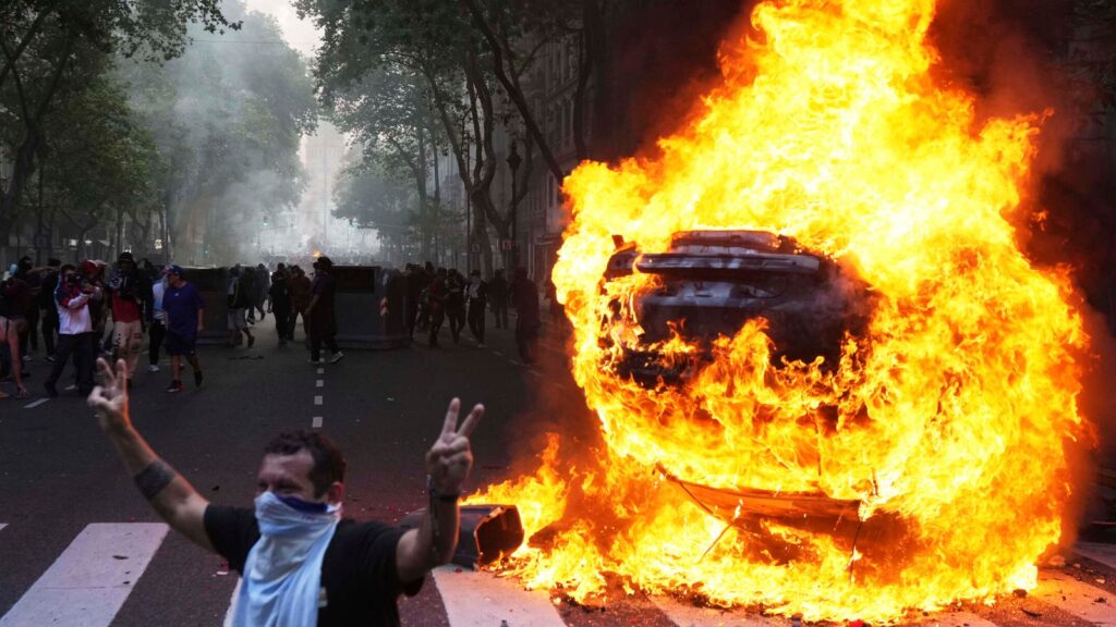 Football fans join with pensioners to clash with police in protest at austerity in Argentina | World News