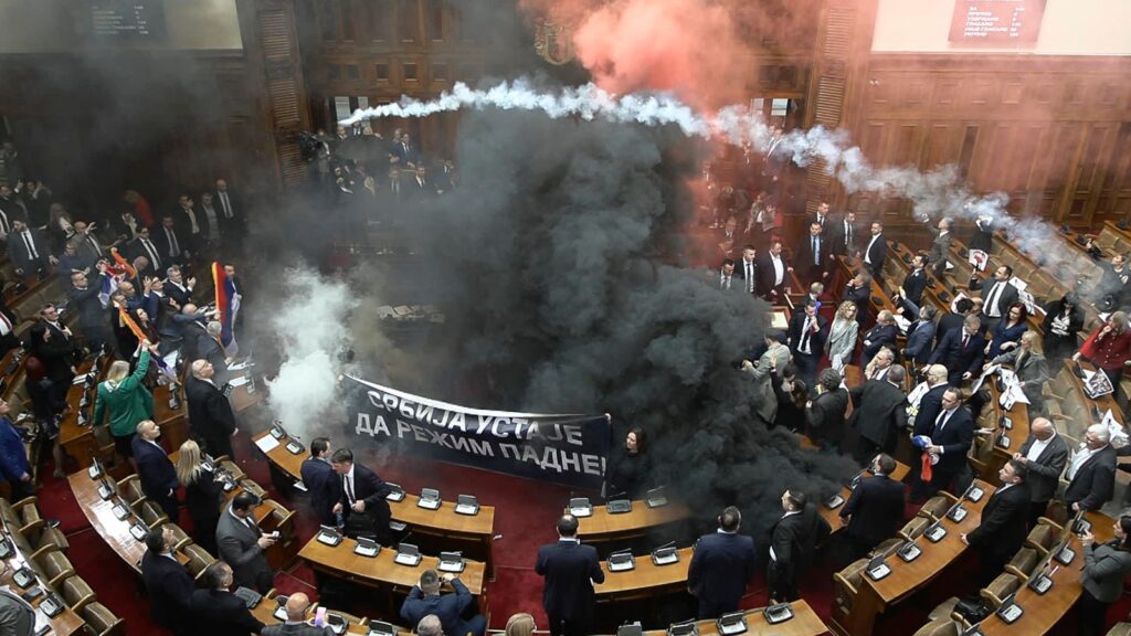 Serbia: Smoke bombs thrown in parliament as three MPs injured | World News