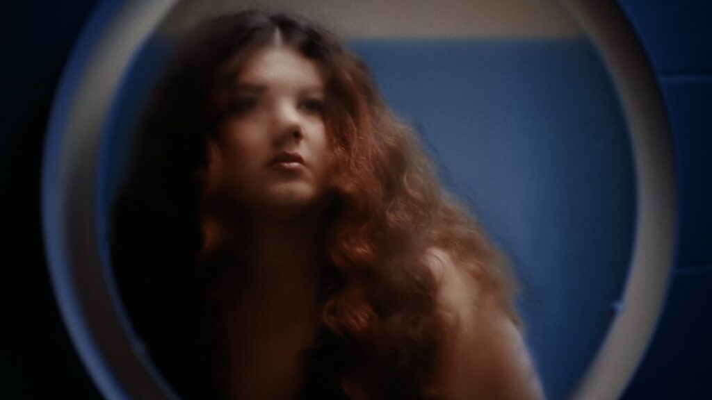 Arrested for Singing While Female, in “My Orange Garden”