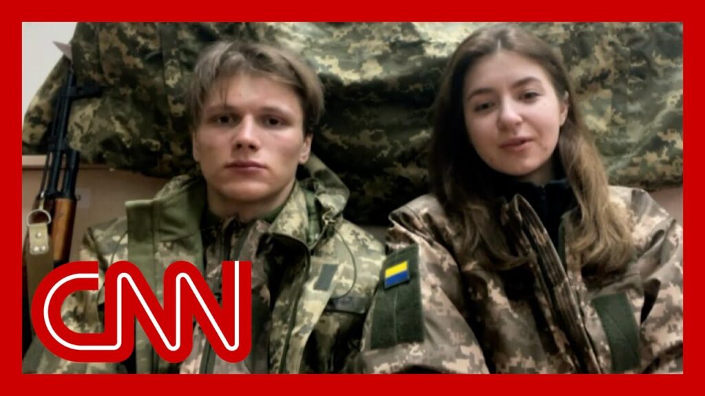 Ukrainian newlyweds take up arms together to defend their country