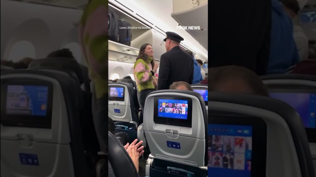 Pilot steps out of the cockpit to hug a passenger who saved his life with a bone marrow donation