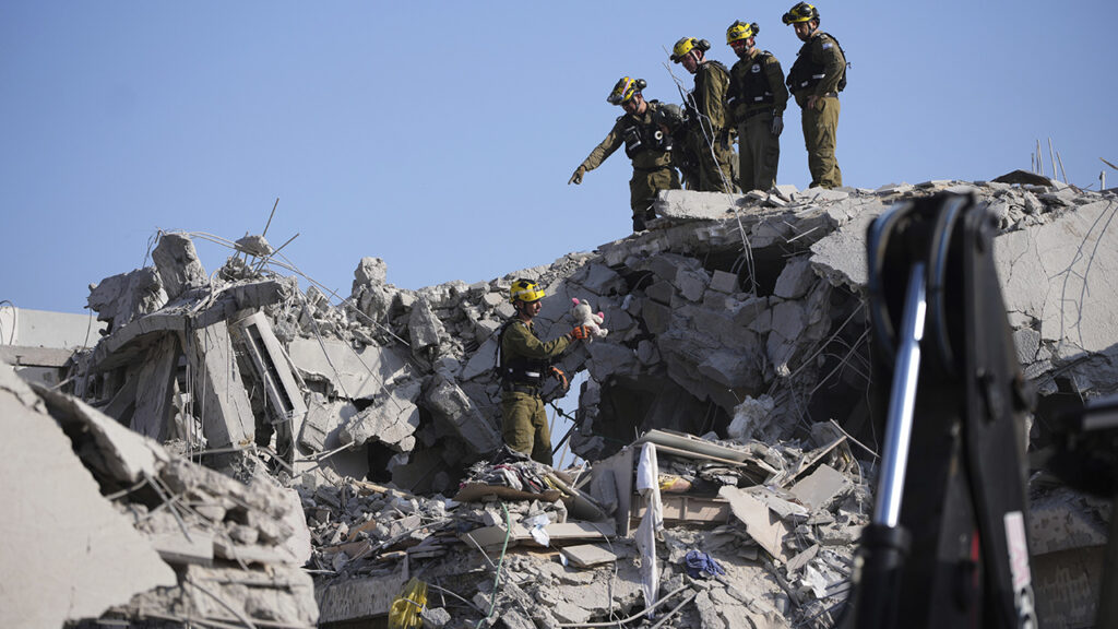 Iranian missile strikes in Israel kill at least 8; defense minister warns ‘Tehran will burn’