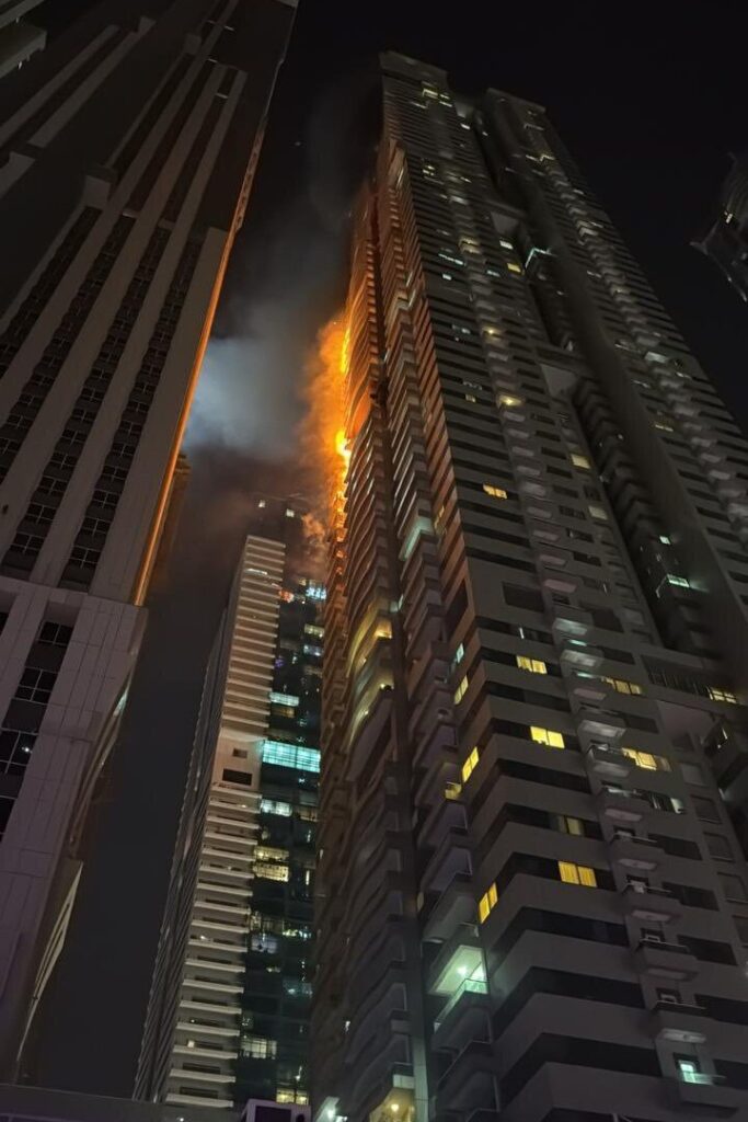 Terrifying moment massive fire rips through 67-storey Dubai Marina skyscraper as 4,000 people flee from high rise