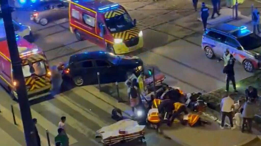 Four injured after car ploughs into crowd celebrating PSG Champions League win in Grenoble with woman fighting for life