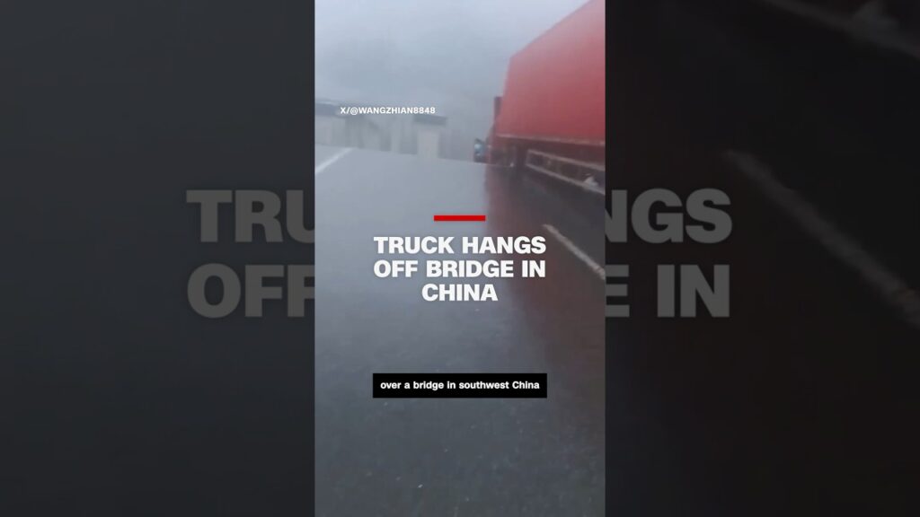 Truck hangs off bridge in China