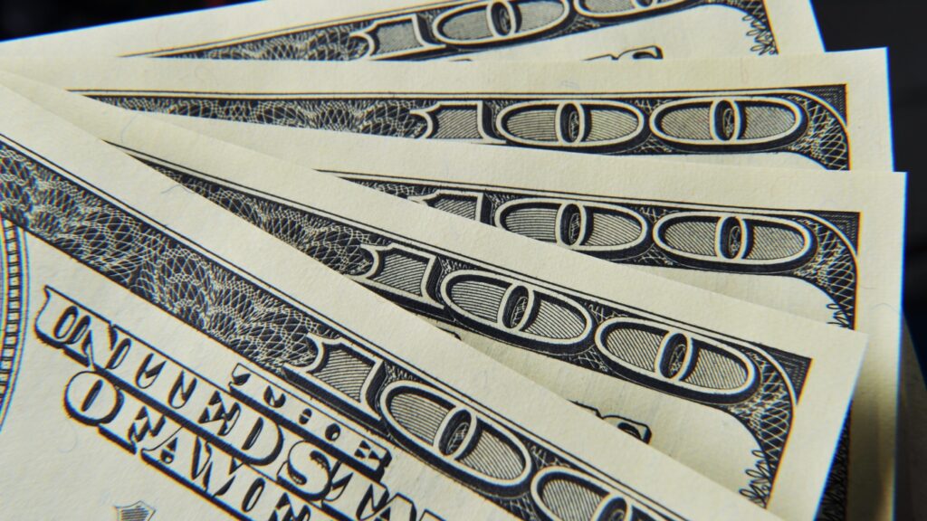 Trump’s trade policies are pushing the dollar down, economist says : NPR