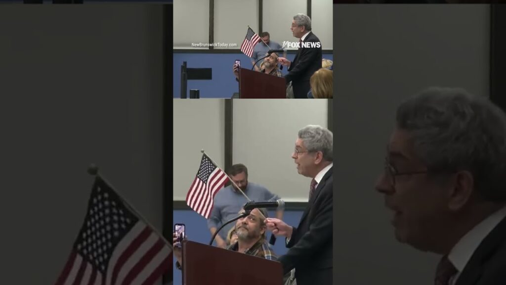 Lawyer removed from city council meeting for waving American flag