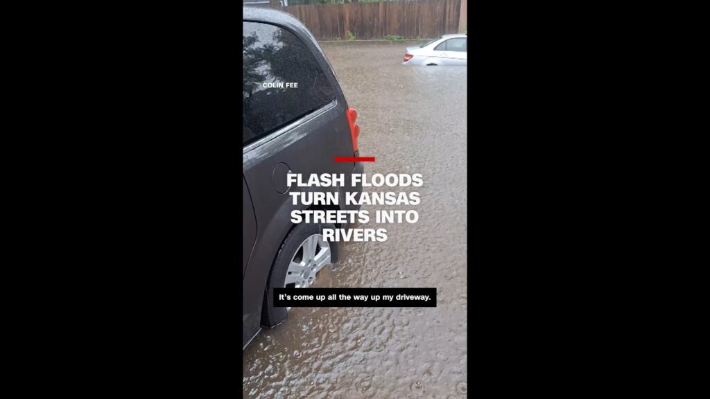 Cars and roads submerged in water during record rainfall in Kansas