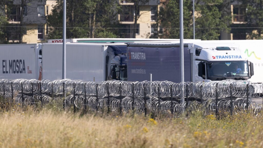 13 freezing UK-bound migrants found trapped in fridge lorry after driver heard them ‘screaming for help’ near Calais