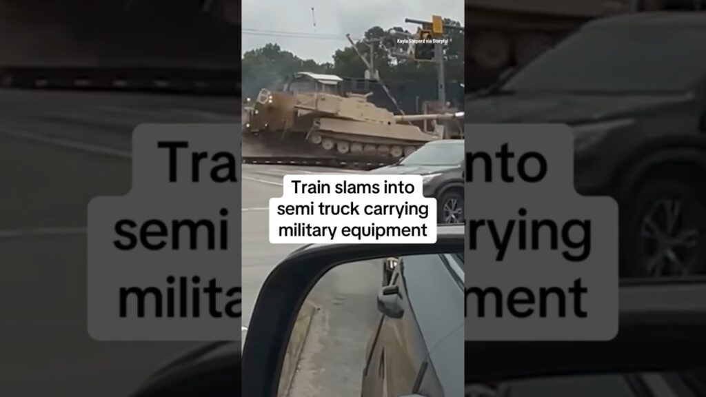 Train slams into semi truck carrying military equipment #shorts