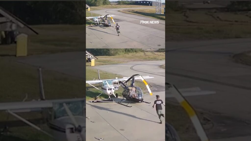 Helicopter spins out of control and crashes into parked plane
