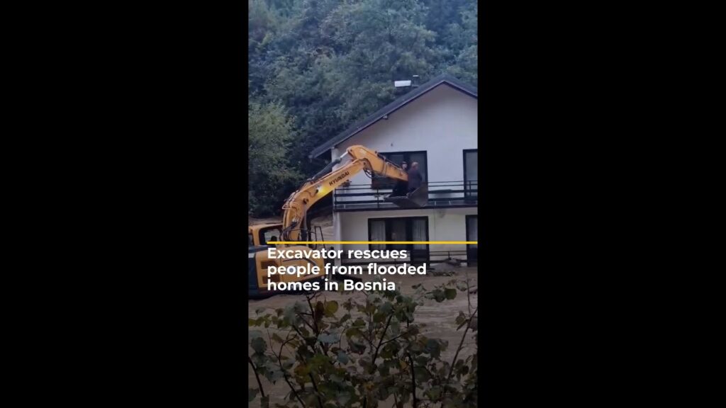Excavator rescues people from flooded homes in Bosnia | AJ #shorts