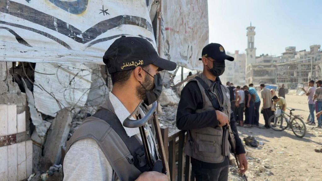 Hamas gunmen spotted in Gaza streets, in limited show of force as ceasefire sets in