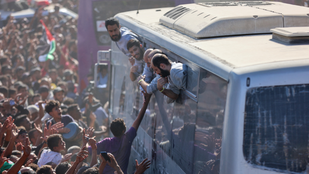 Moment buses carrying 2,000 freed Palestinian prisoners including murderers & terrorists arrive in Gaza