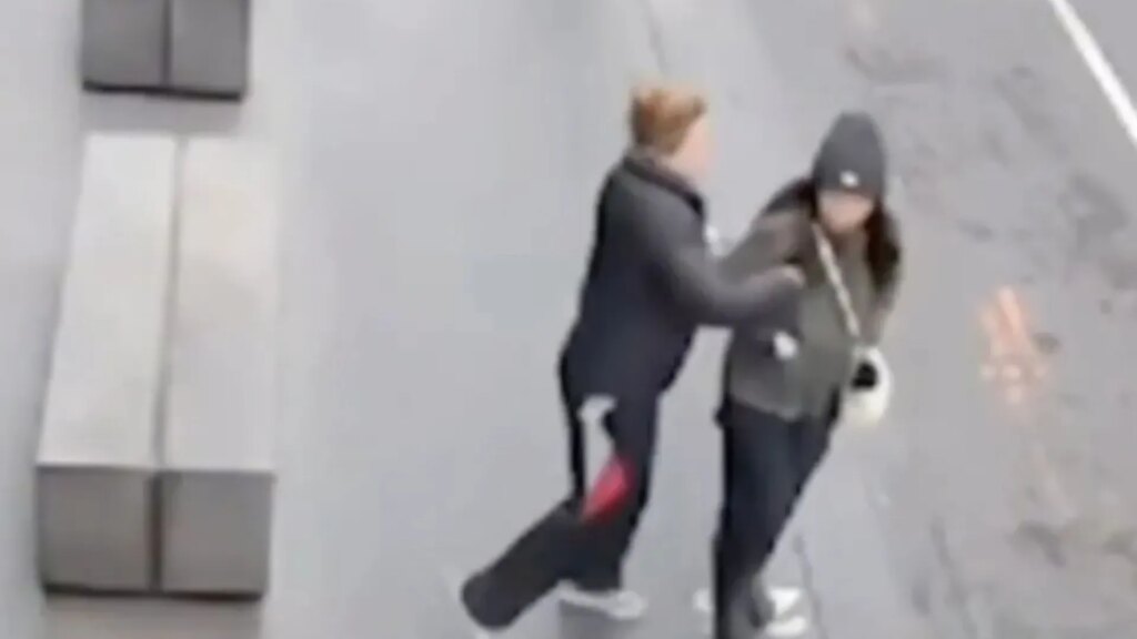 Terrifying moment woman is stabbed by stranger while she walks to work as CCTV vid captures horrific unprovoked attack